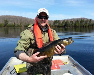 Lead author Andrew Rypel, currently an associate professor at UC Davis, holds a walleye in Wisconsin. (Courtesy Andrew Rypel)