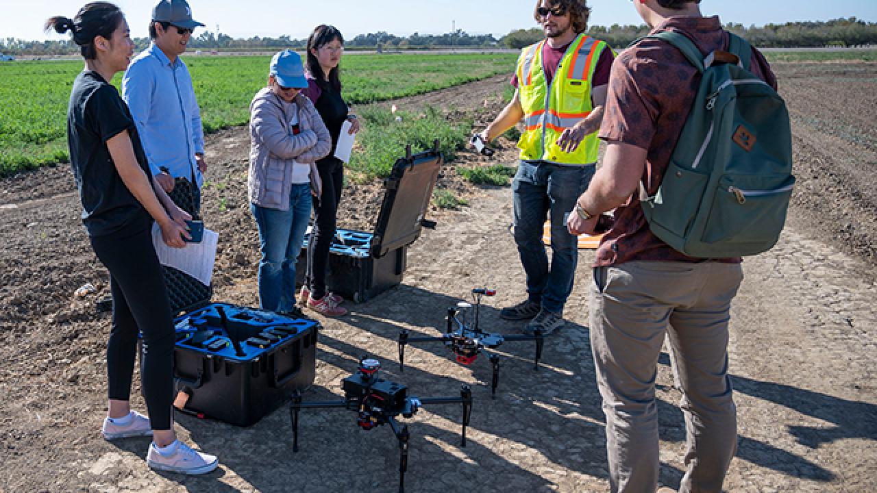 Students learning to use a drone in the "Introduction to Unmanned Aerial Systems for Agriculture and Environmental Science" class last year.