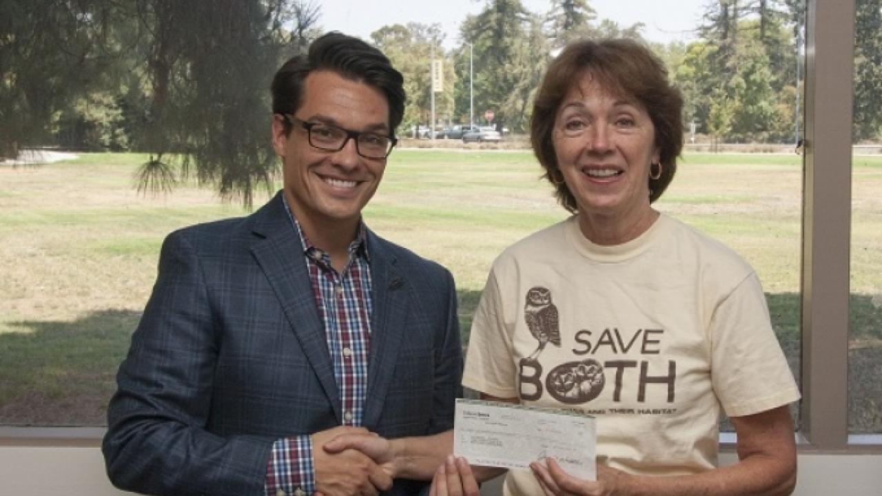Catherine Portman (right) created an endowment to fund student research into burrowing owls. With her is Patrick Nolan, a development officer with the College of Agricultural and Environmental Sciences. John Stumbos/UC Davis