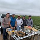 Vougioukas with lab members and the strawberry harvest-aid FRAIL-bot. (Stavros Vougioukas/UC Davis)